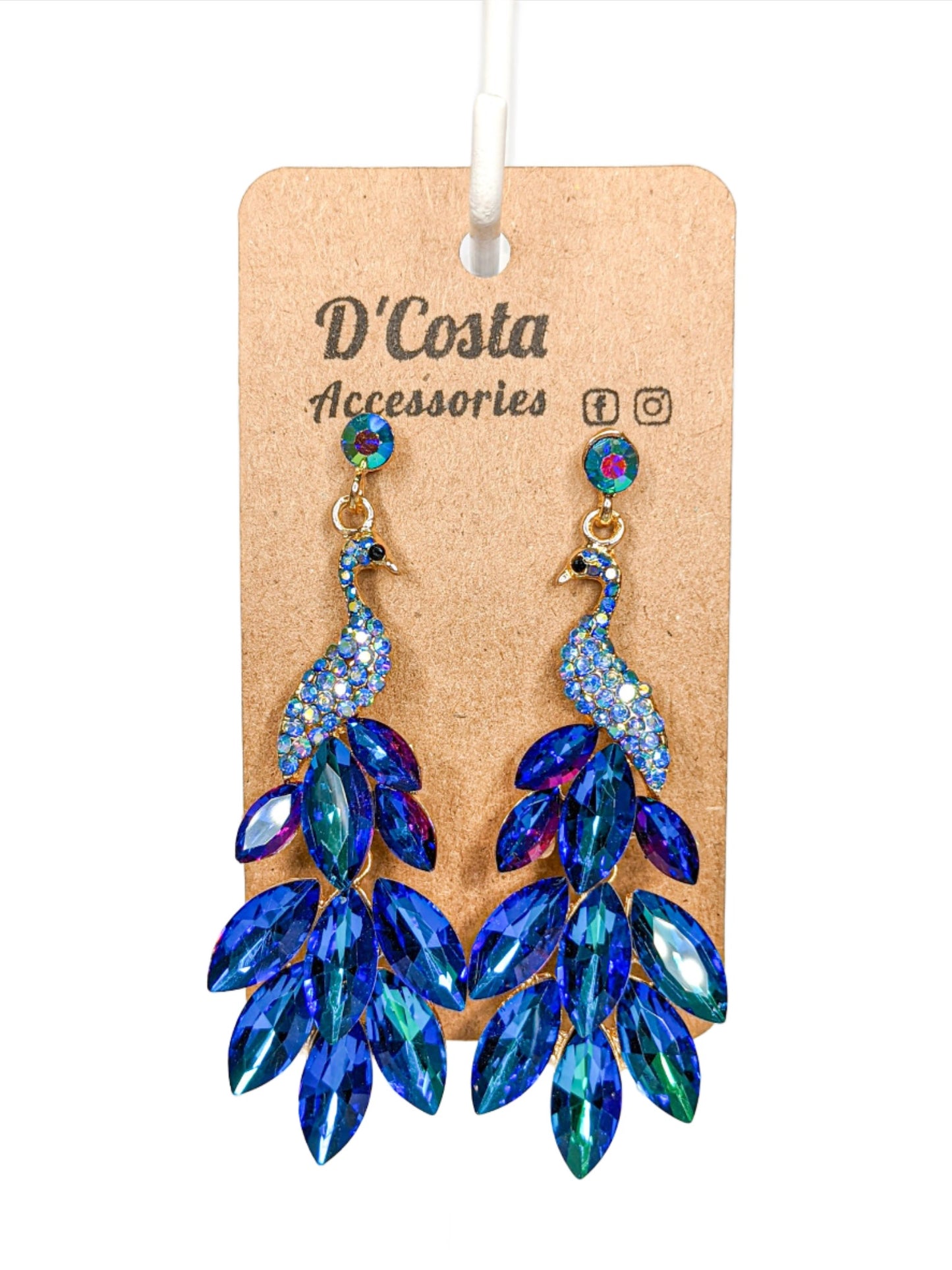 Large royal blue statement peacock earrings, encrusted with royal blue diamante tails and set in a gold tone peacock body.