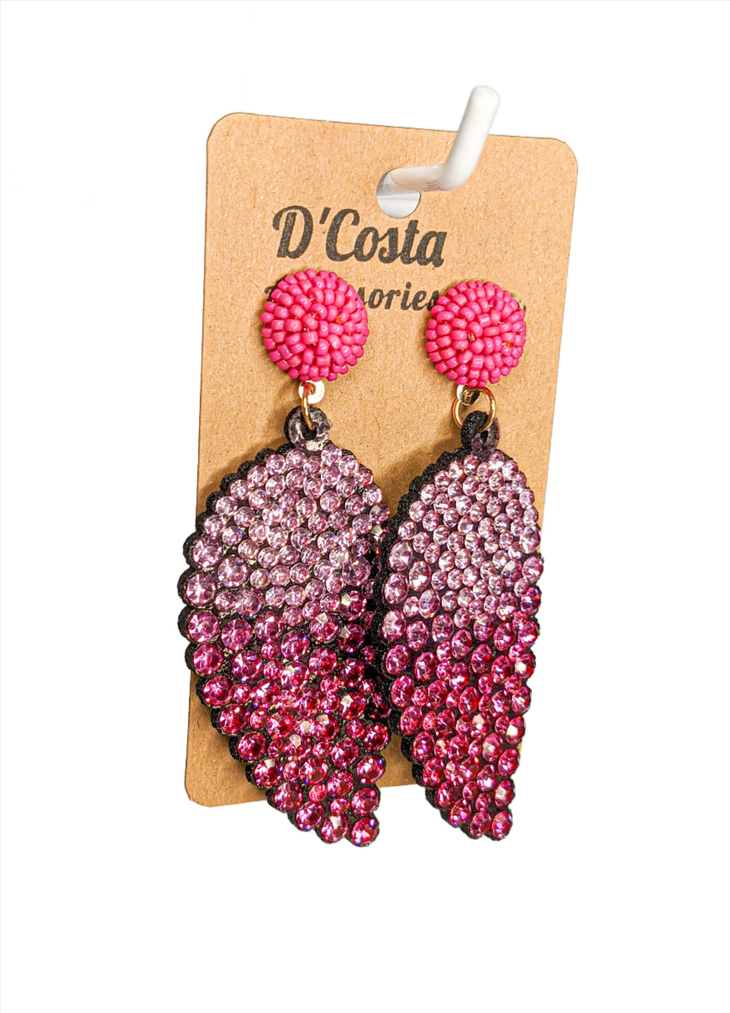 Leaf shaped statement drop earrings encrusted in pink diamante rhinestones.