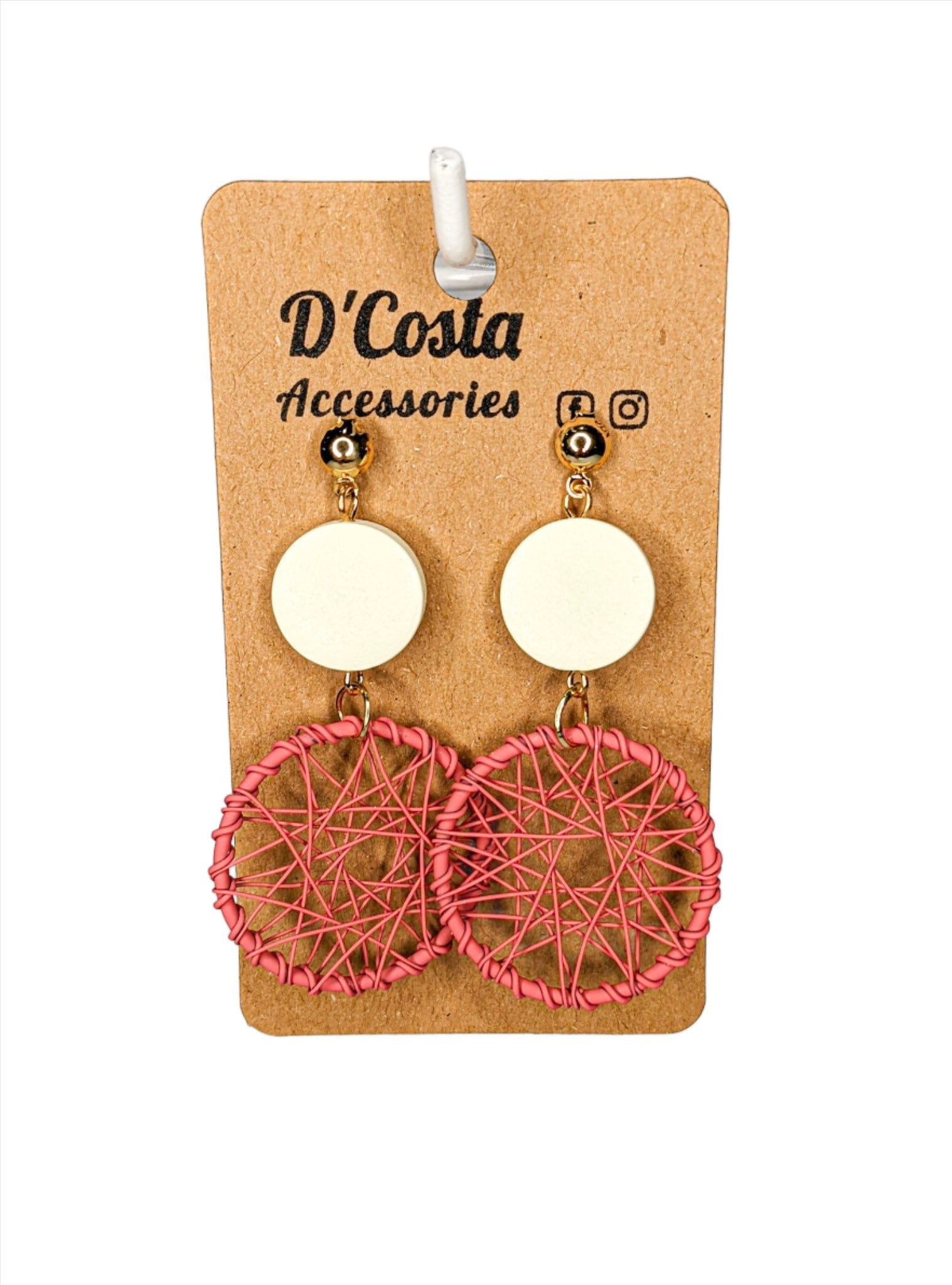 Large statement pink woven circle drop earrings with white circles above.