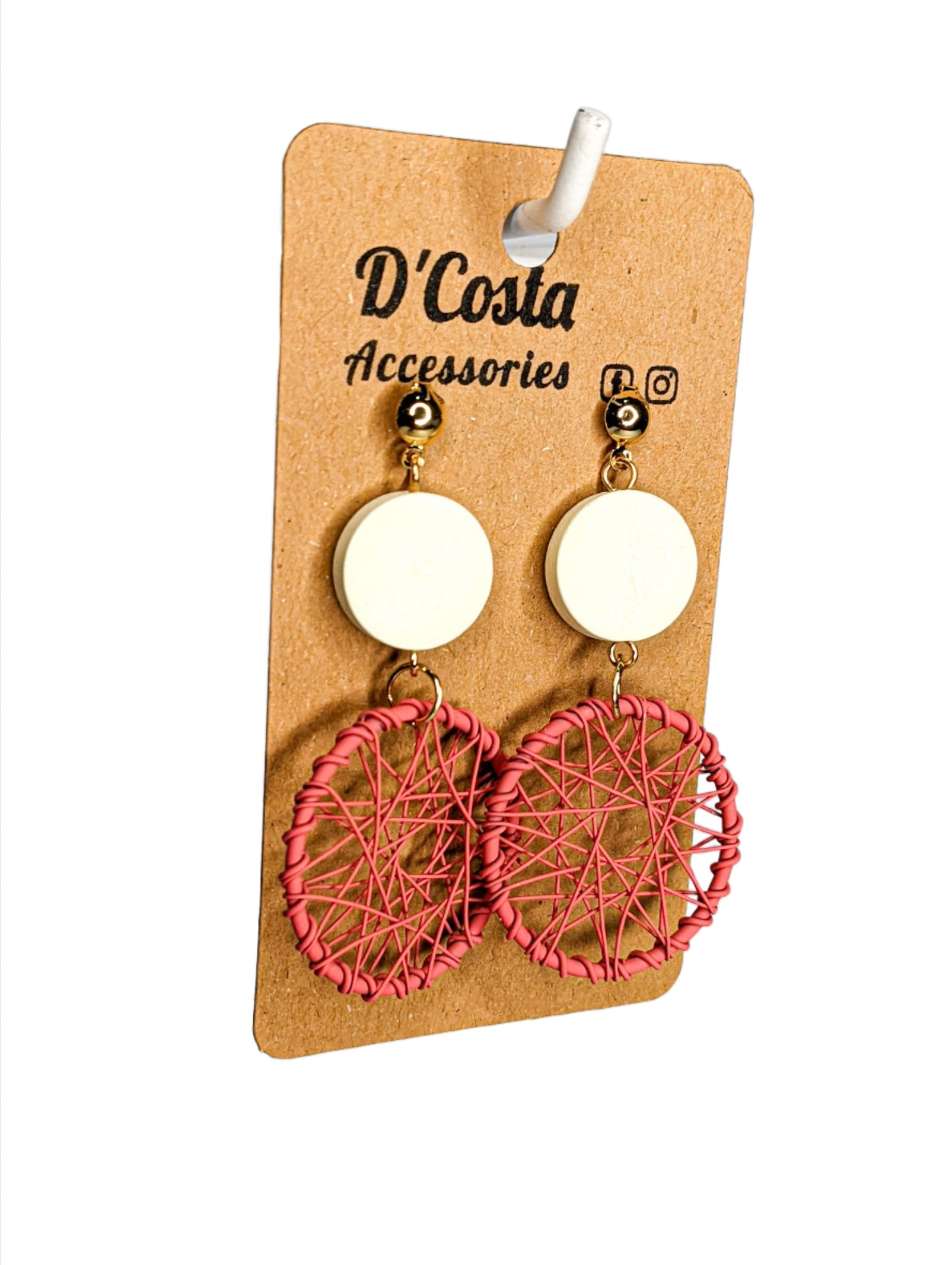 Large statement pink woven circle drop earrings with white circles above.