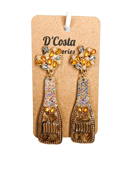 Brown, yellow and gold coloured rhinestone diamante champagne bottle statement earrings. Encrusted with pearlescent diamantes