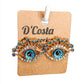 Evil eye statement stud earrings with blue and white pearlescent diamantes