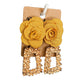 Gold coloured rectangular geometric drop earrings featuring a large yellow fabric flower